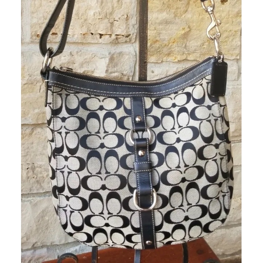 A Coach Chelsea Signature canvas duffel shoulder bag